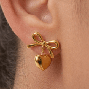 Gold bow stud earrings with heart charm for women